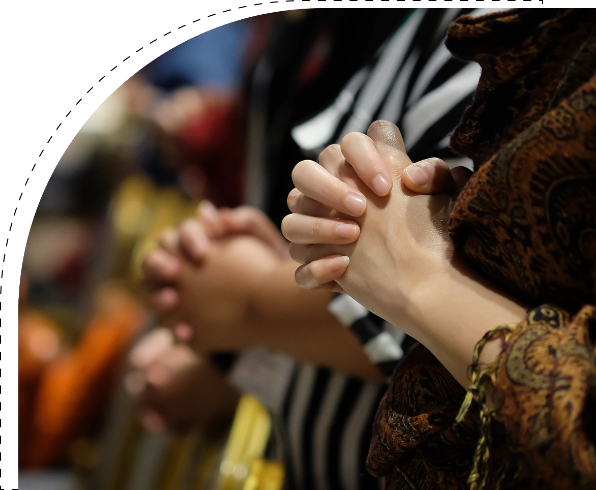 A group of people with their hands clasped together.