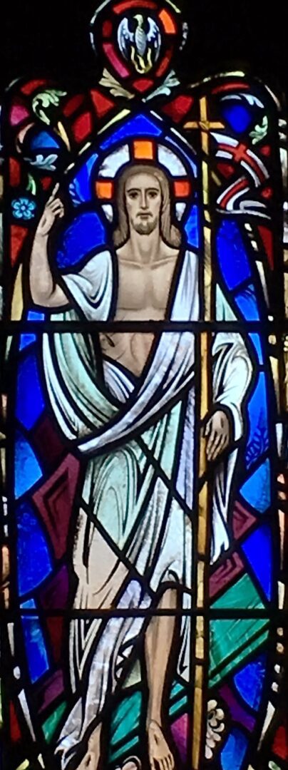 A stained glass window of jesus christ.