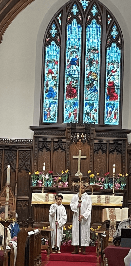 A church with stained glass windows and a cross